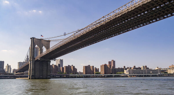 Brooklyn Bridge in New York City during bright summer day