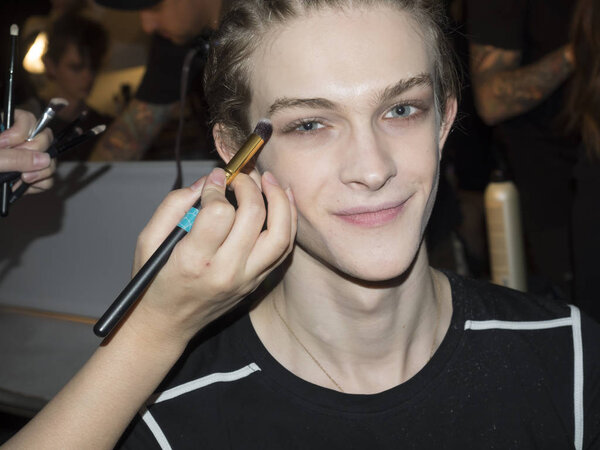 model prepares backstage