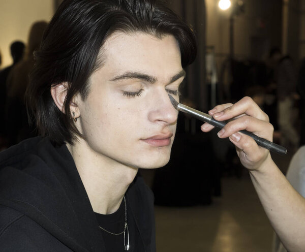 model prepares backstage