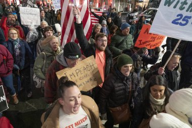 New York, NY - December 17, 2019: Few hundreds people rally in support of impeachment of President Trump from Times Square to Union Square along Broadway