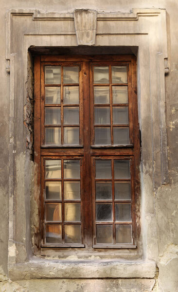 The decorated window of the old building