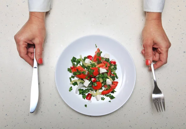 Hands with kitchen flatware — Stock Photo, Image