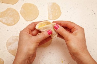 chef prepares dumplings with curd clipart