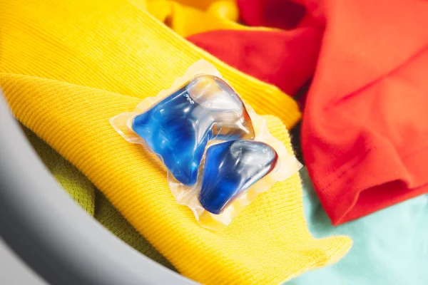 Blue gel caps in washing mashine — Stock Photo, Image