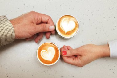 lovers with cups of coffee clipart