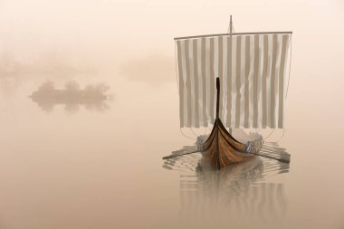 Viking ship on the water in the mystical fog. clipart