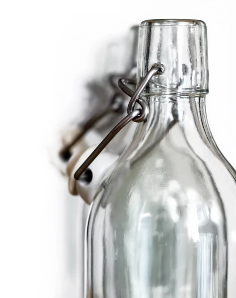 Neck of glass bottles with a porcelain stopper — Stock Photo, Image