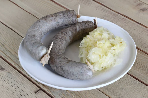 Sausage with sauerkraut — Stock Photo, Image