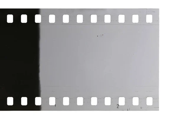 Tira de filme celuloide antigo com poeira e arranhões — Fotografia de Stock