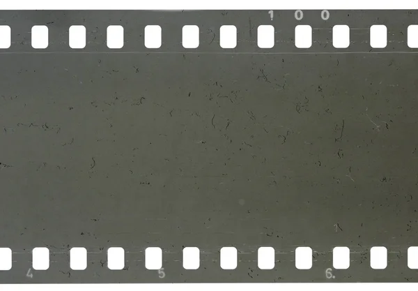 Tira de película celuloide vieja con polvo y arañazos — Foto de Stock