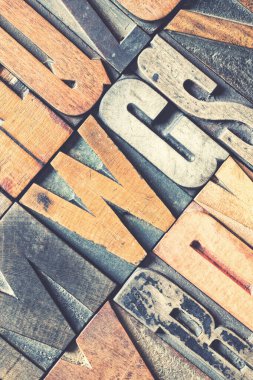 Closeup of vintage wood printing blocks with retro style processing. clipart