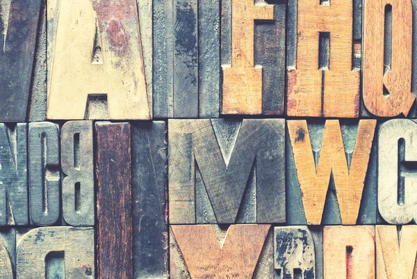 Detail of vintage wooden printing blocks with retro style processing.