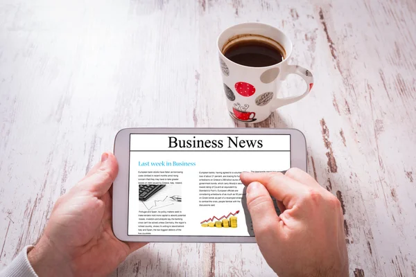 Tablet with business news — Stock Photo, Image