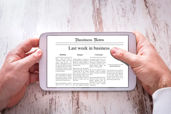 Tablet with business news — Stock Photo, Image