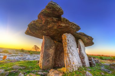 Poulnabrone portal tomb in Burren at sunrise clipart
