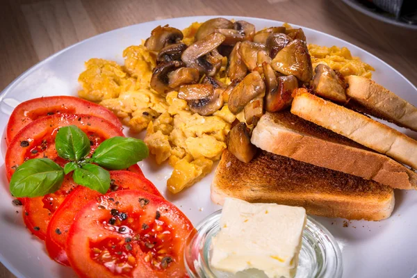Breakfast table with scrambled eggs — Stock Photo, Image