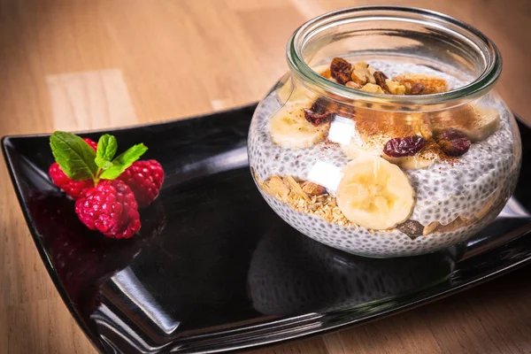 Chia seed pudding with nuts and slices of banana — Stock Photo, Image