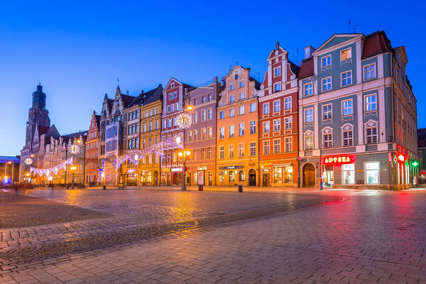 WROCLAW, POLAND - DECEMBER 28, 2016: Architecture of the Market Square in Wroclaw at dusk, Poland. Wroclaw is the largest city in western Poland and historical capital of Silesia.