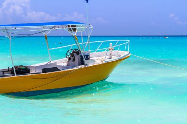 Yellow boat on the coast of Caribbean Sea clipart