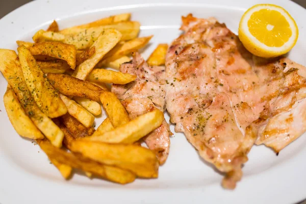 Grilled chicken fillet with french fries — Stock Photo, Image