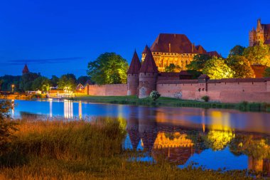 The Castle of the Teutonic Order in Malbork at night clipart