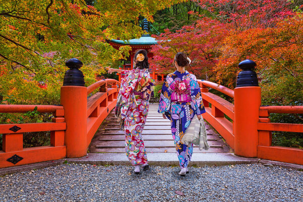 Women in traditional japanese kimonos walking in Kyoto, Japan