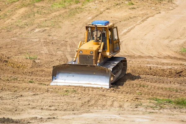 Yellow bulldozer with caterpillar