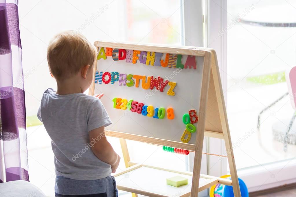 Little boy learning alphabet 