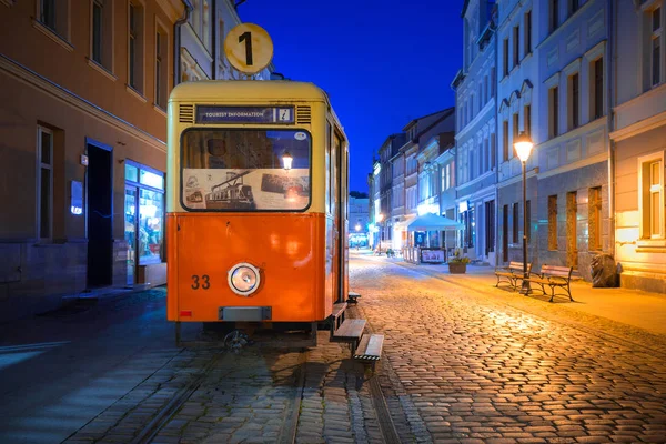 Bydgoszcz city with old tram used as tourist information at night — Stock Photo, Image