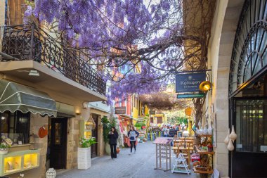 Narrow streets with souvenirs in Venetian port of Chania on Crete, Greece clipart