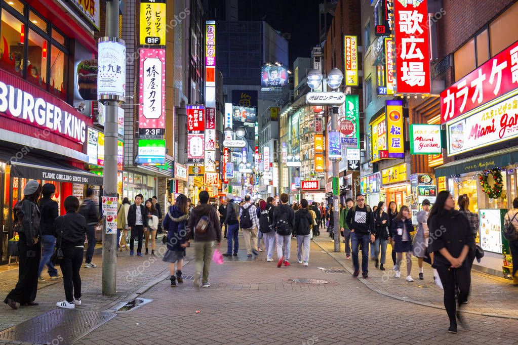 Busy streets of Shibuya district in Tokyo at night, Japan – Stock ...