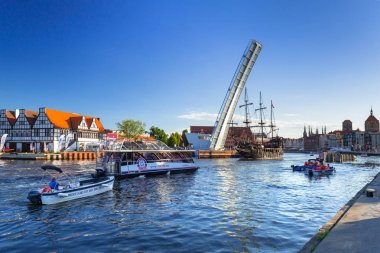 Tourist ship on the Motlawa river in Gdansk clipart