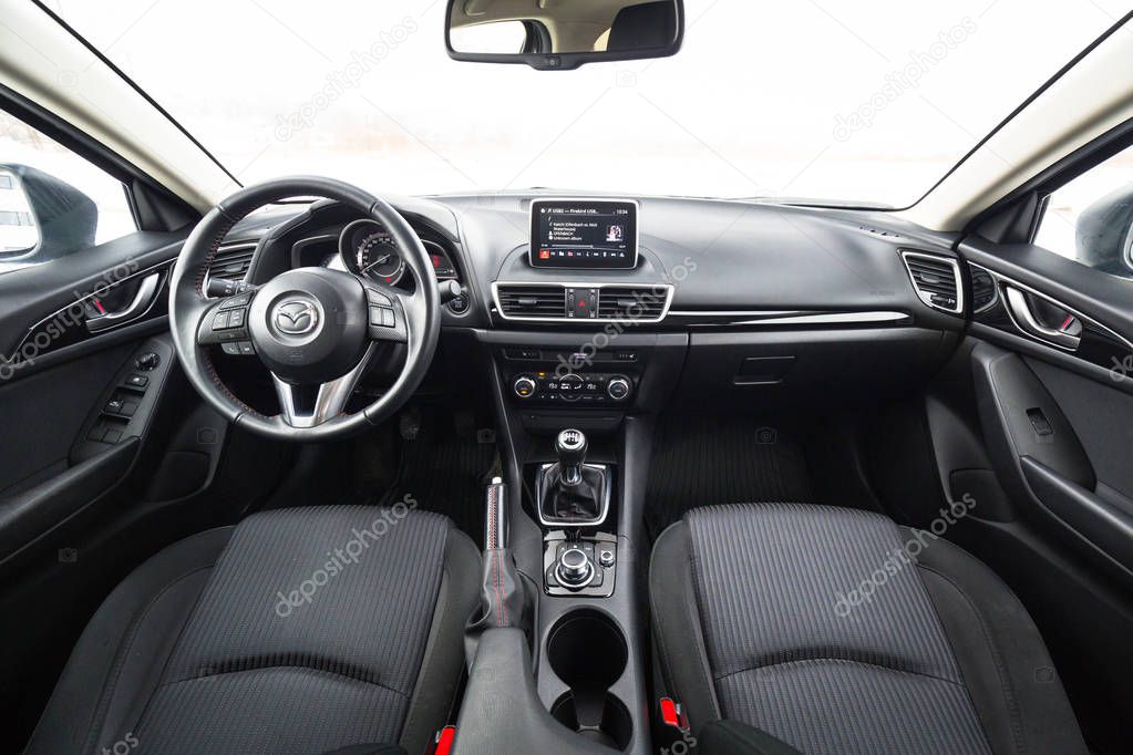 POLAND - FEBRUARY 11, 2018: Black interior of Mazda 3 captured in winter time. Mazda 3 is a popular compact car manufactured in Japan by the Mazda Motor Corporation.