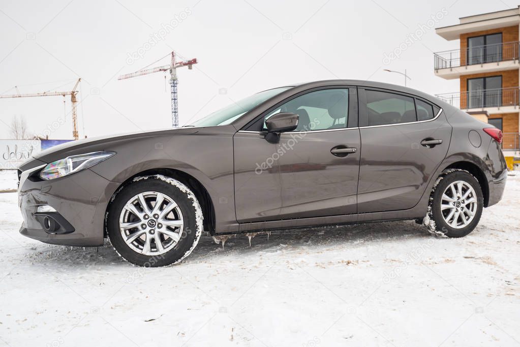 POLAND - FEBRUARY 11, 2018: Compact car Mazda 3 captured in winter time. Mazda 3 is a popular compact car manufactured in Japan by the Mazda Motor Corporation.