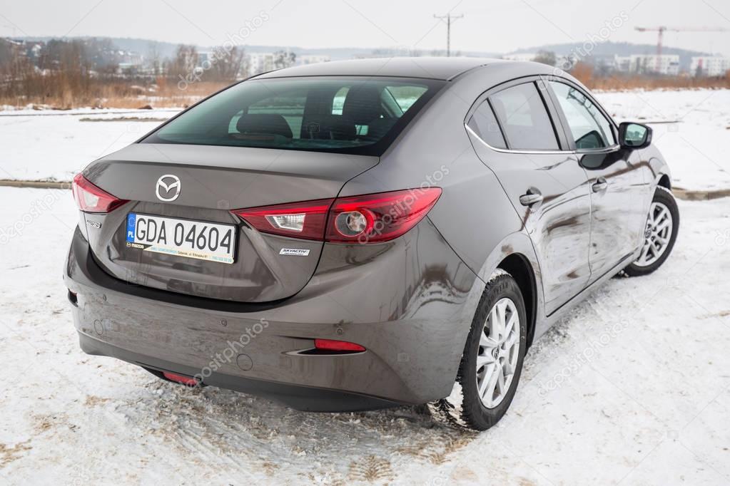 POLAND - FEBRUARY 11, 2018: Compact car Mazda 3 captured in winter time. Mazda 3 is a popular compact car manufactured in Japan by the Mazda Motor Corporation.