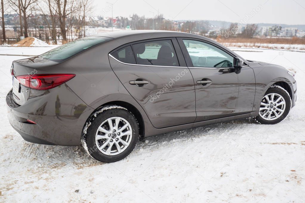POLAND - FEBRUARY 11, 2018: Compact car Mazda 3 captured in winter time. Mazda 3 is a popular compact car manufactured in Japan by the Mazda Motor Corporation.