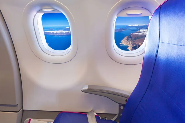 Empty seat at the window of passenger airplane — Stock Photo, Image