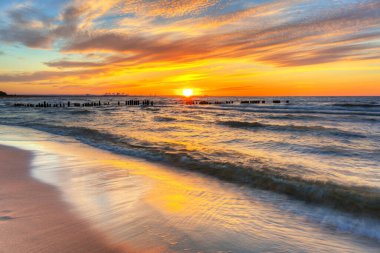 Beautiful beach of the Baltic Sea at sunset in Gdansk, Poland