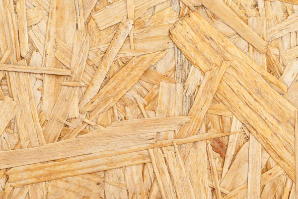 Chipboard. Close up pressed wooden panel background, OSB wood