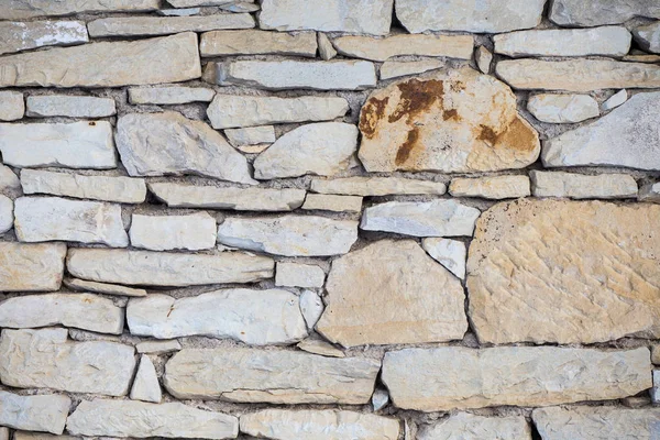 Stenmur. Natursten utomhus bakgrund - sandsten — Stockfoto