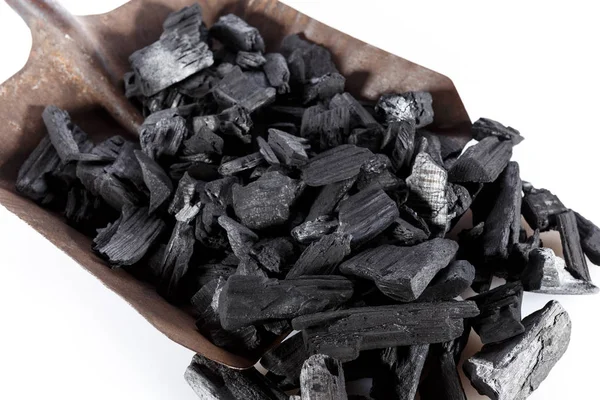 Pile of charcoal and shovel isolated on white — Stock Photo, Image