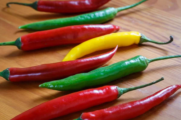 Hot chili peppers. Chilli pepper on the wooden background. — Stock Photo, Image
