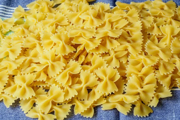 Heap of farfalle pasta. Top view — Stock Photo, Image