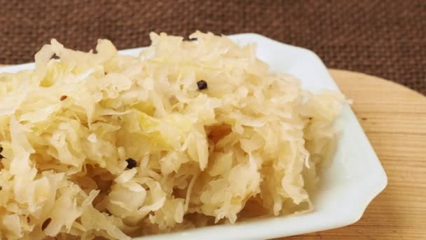 Fresh healthy sauerkraut on white plate — Stock Footage Fresh Healthy Sauerkraut White Plate Royalty Free Stock Video
