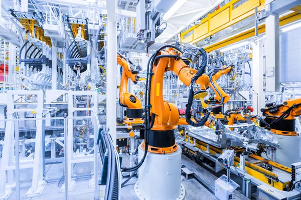Robots en una planta de automóviles Imagen De Stock