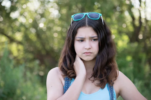Portrait of sad teen girl on nature — Stock Photo, Image