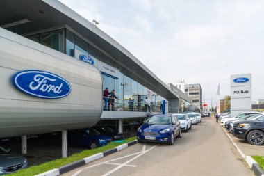 Khimki, Russia - September 12.2016. Car Dealer to sell cars Ford and Rolf clipart