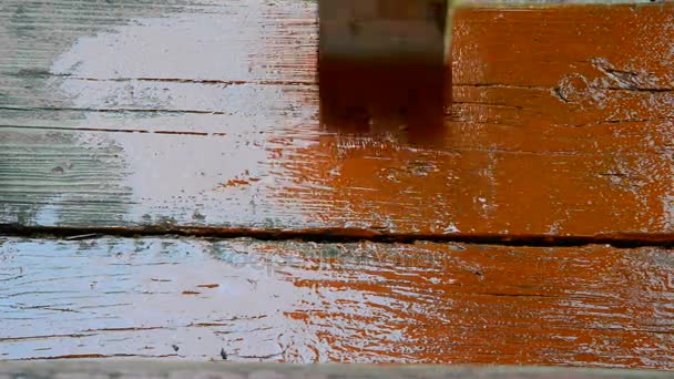 Person paints with red paint old stairs — Stock Video