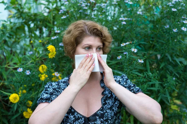 Woman with allergic rhinitis by pollen