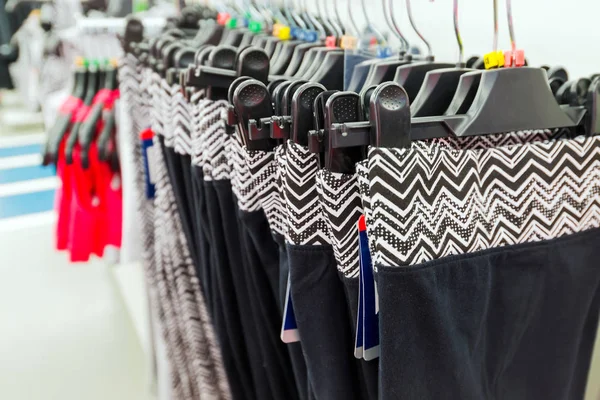 Womens sports pants on hanger in store — Stock Photo, Image